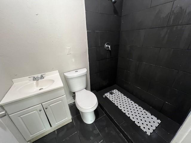 2227 Westway St, Orange, TX 77630 - full bathroom featuring tiled shower and vanity
