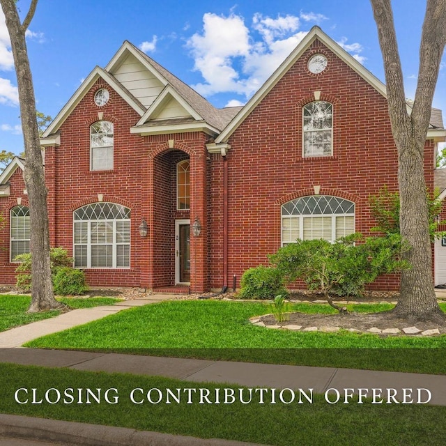 4426 Park Bend Dr, Baytown, TX 77521 - view of front of property with brick siding and a front lawn