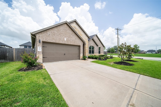 127 Dorado Dr, Friendswood, TX 77546 - french provincial home featuring stone siding, driveway, a garage, and brick siding
