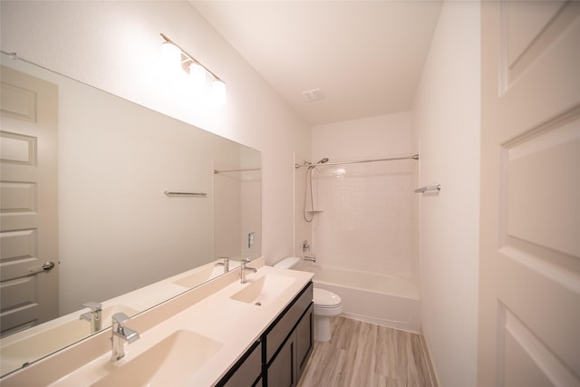127 Dorado Dr, Friendswood, TX 77546 - full bath featuring double vanity, shower / washtub combination, and wood finished floors