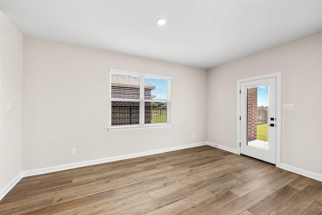 3004 Myrtle Sunset Dr, Katy, TX 77493 - empty room featuring wood finished floors and recessed lighting