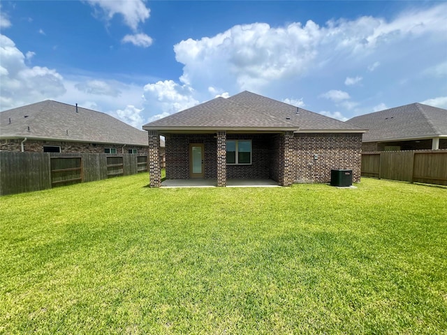 3004 Myrtle Sunset Dr, Katy, TX 77493 - rear view of property with a patio, a fenced backyard, brick siding, and a shingled roof