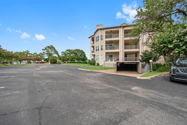 12800 Melville Dr Unit B207, Montgomery, TX 77356 - view of apartment building / complex with uncovered parking
