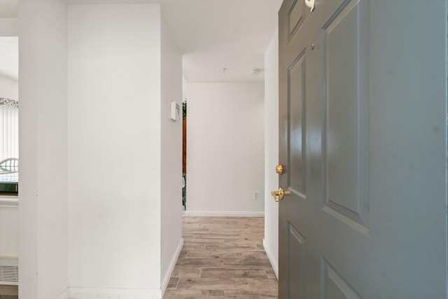 12800 Melville Dr Unit B207, Montgomery, TX 77356 - hallway featuring light wood finished floors and baseboards