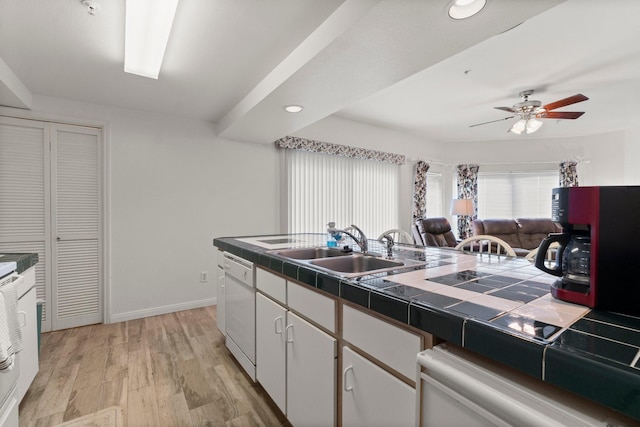 12800 Melville Dr Unit B207, Montgomery, TX 77356 - kitchen with tile countertops, light wood-type flooring, a ceiling fan, dishwasher, and recessed lighting