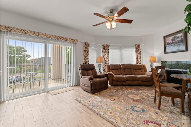 12800 Melville Dr Unit B207, Montgomery, TX 77356 - living area featuring a ceiling fan and wood finished floors
