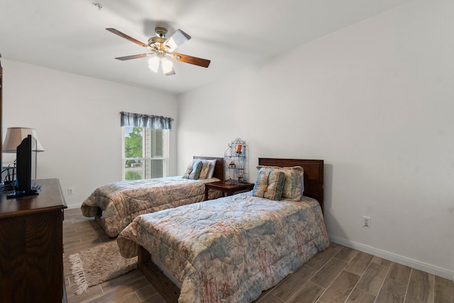 12800 Melville Dr Unit B207, Montgomery, TX 77356 - bedroom featuring wood finish floors and a ceiling fan