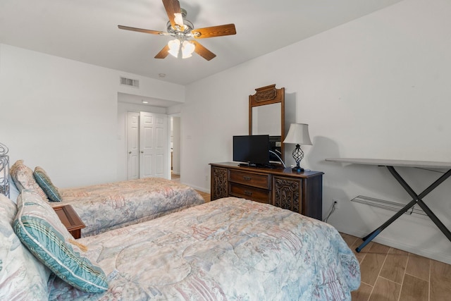 12800 Melville Dr Unit B207, Montgomery, TX 77356 - bedroom with wood finished floors and ceiling fan