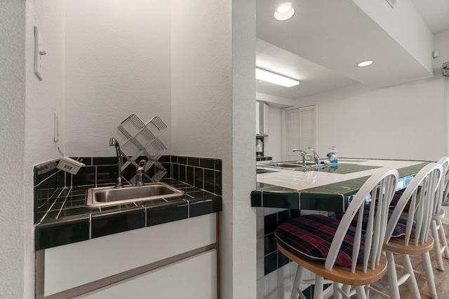 12800 Melville Dr Unit B207, Montgomery, TX 77356 - bathroom featuring vanity, recessed lighting, and backsplash