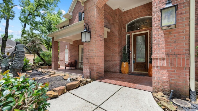 37703 Edgewater Dr, Pinehurst, TX 77362 - doorway to property with brick siding and a porch