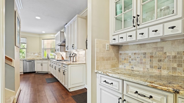 37703 Edgewater Dr, Pinehurst, TX 77362 - kitchen with appliances with stainless steel finishes, dark wood finished floors, backsplash, light stone countertops, and recessed lighting