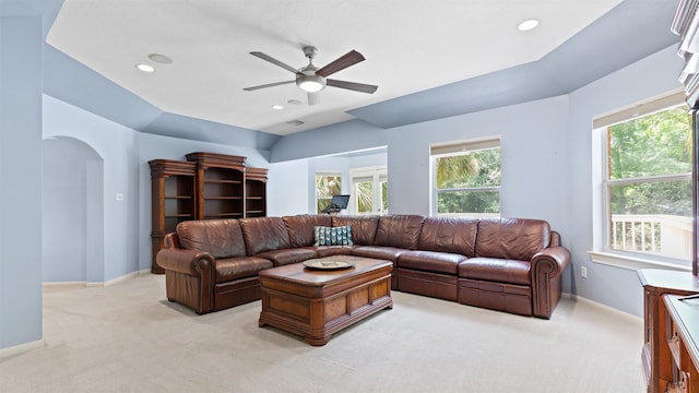 37703 Edgewater Dr, Pinehurst, TX 77362 - living area with light colored carpet, ceiling fan, recessed lighting, and arched walkways