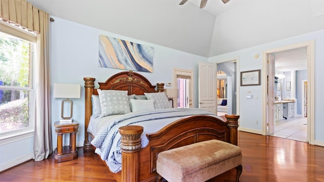 37703 Edgewater Dr, Pinehurst, TX 77362 - bedroom with wood finished floors, lofted ceiling, ensuite bathroom, and ceiling fan