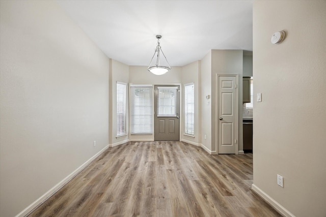 3200 Bellefontaine St Unit 72, Houston, TX 77025 - entrance foyer with light wood-style floors and baseboards