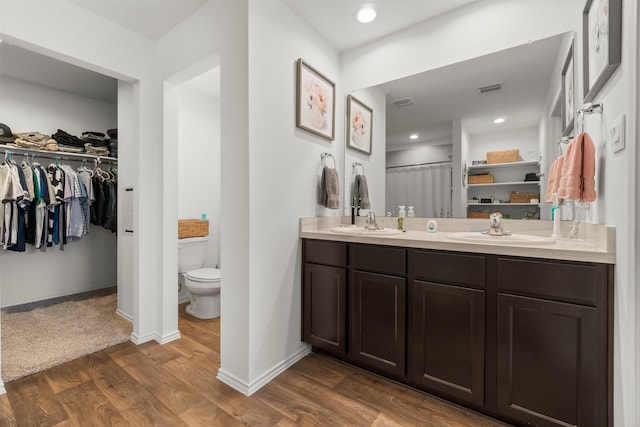 5315 Shady Olive St, Katy, TX 77449 - full bath with wood finished floors, a walk in closet, and double vanity