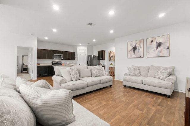 5315 Shady Olive St, Katy, TX 77449 - living room with recessed lighting and light wood-style flooring