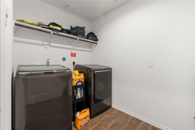 5315 Shady Olive St, Katy, TX 77449 - washroom with separate washer and dryer and wood finished floors