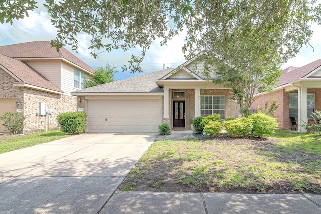 2954 Smokey Forest Ln, Spring, TX 77386 - view of front of property with a garage, brick siding, concrete driveway, and roof with shingles