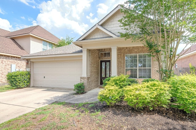 2954 Smokey Forest Ln, Spring, TX 77386 - view of front of property with a garage, brick siding, driveway, and a shingled roof