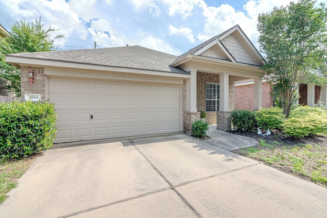 2954 Smokey Forest Ln, Spring, TX 77386 - view of front of property with brick siding, driveway, and an attached garage