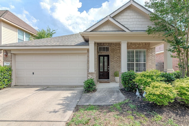 2954 Smokey Forest Ln, Spring, TX 77386 - view of front of home featuring brick siding, concrete driveway, an attached garage, and roof with shingles