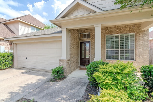 2954 Smokey Forest Ln, Spring, TX 77386 - property entrance featuring driveway, a garage, and brick siding