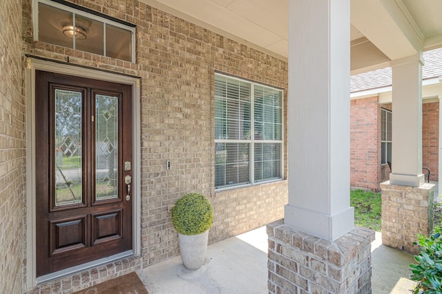 2954 Smokey Forest Ln, Spring, TX 77386 - view of exterior entry with covered porch and brick siding