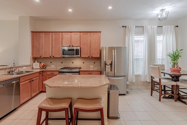 2954 Smokey Forest Ln, Spring, TX 77386 - kitchen featuring stainless steel appliances, a center island, decorative backsplash, light tile patterned floors, and recessed lighting