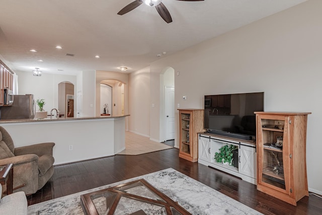 2954 Smokey Forest Ln, Spring, TX 77386 - living area featuring hardwood / wood-style floors, arched walkways, a ceiling fan, and recessed lighting
