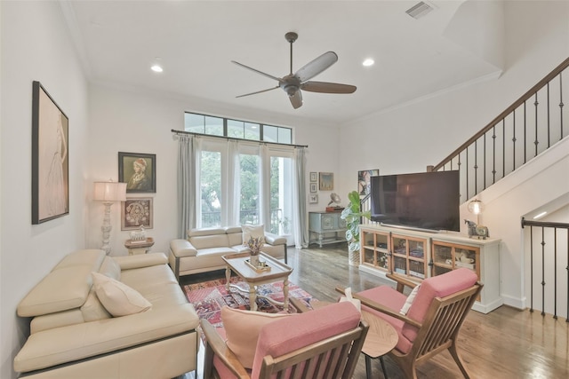 3937 Law St, Houston, TX 77005 - living area featuring ceiling fan, wood finished floors, ornamental molding, recessed lighting, and stairway