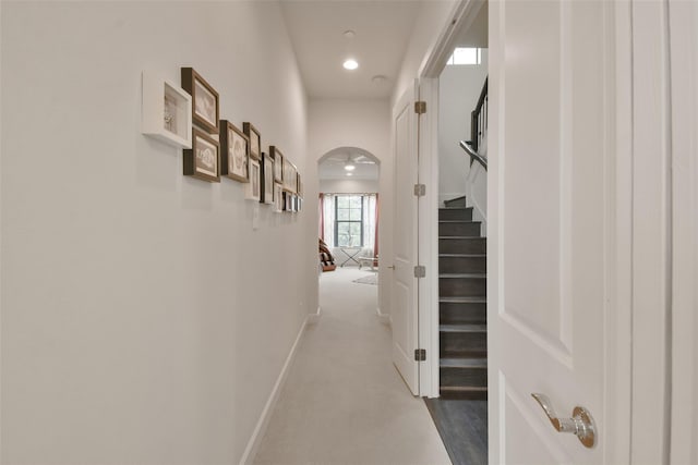 3937 Law St, Houston, TX 77005 - hallway featuring stairway, dark colored carpet, recessed lighting, and arched walkways