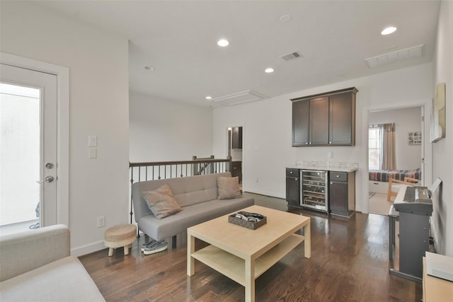 3937 Law St, Houston, TX 77005 - living area with wine cooler, dark wood-type flooring, recessed lighting, attic access, and a dry bar