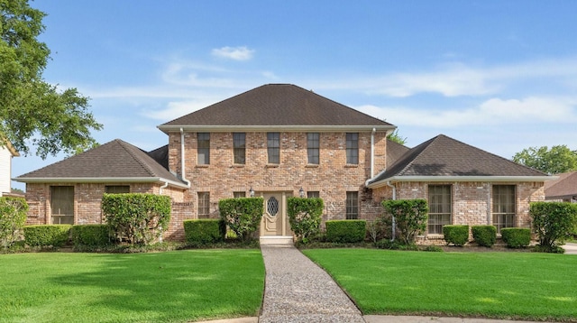 15718 Craighurst Dr, Houston, TX 77059 - view of front of home featuring a front yard, brick siding, and roof with shingles