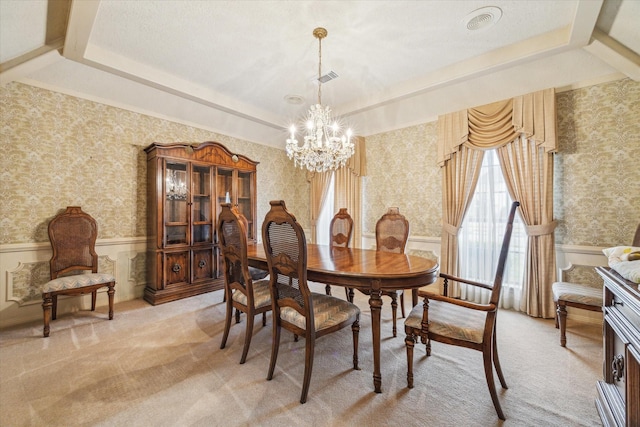 15718 Craighurst Dr, Houston, TX 77059 - dining space featuring wallpapered walls, a chandelier, light carpet, a wainscoted wall, and a raised ceiling