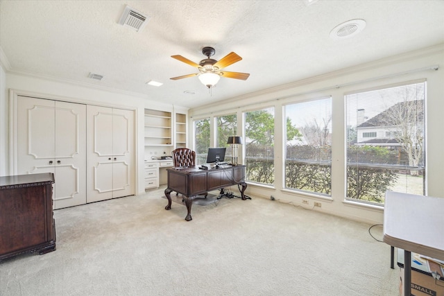 15718 Craighurst Dr, Houston, TX 77059 - office featuring ceiling fan, ornamental molding, light carpet, a textured ceiling, and built in features