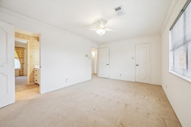 15718 Craighurst Dr, Houston, TX 77059 - unfurnished bedroom featuring light colored carpet, crown molding, connected bathroom, and ceiling fan
