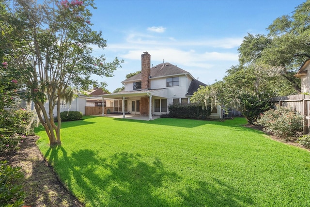 15718 Craighurst Dr, Houston, TX 77059 - back of house with a patio area, a chimney, and brick siding