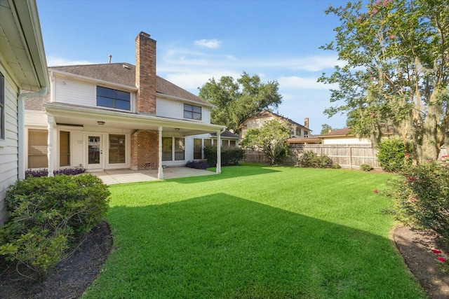 15718 Craighurst Dr, Houston, TX 77059 - rear view of property featuring a fenced backyard, a chimney, and a patio