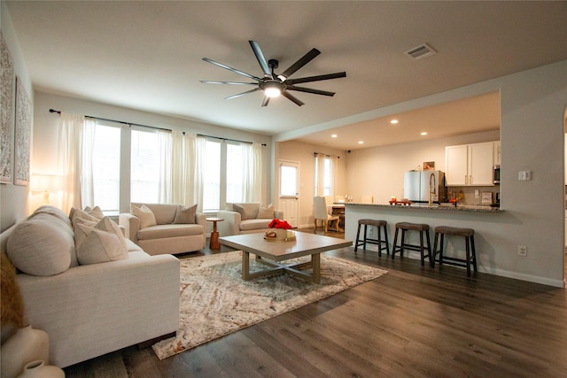 22118 Great Royal Ln, Houston, TX 77073 - living room featuring a ceiling fan, dark wood finished floors, and recessed lighting