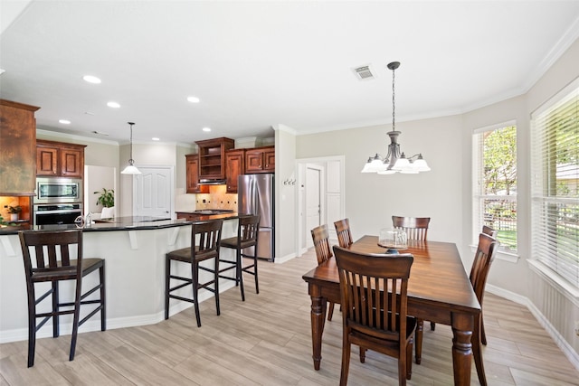 18882 Mystic Pt, Montgomery, TX 77356 - dining space with a chandelier, light wood-type flooring, ornamental molding, and recessed lighting