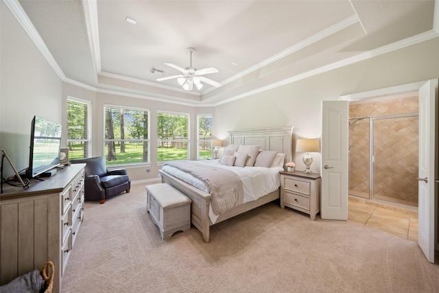 18882 Mystic Pt, Montgomery, TX 77356 - bedroom featuring a tray ceiling, light carpet, crown molding, and a ceiling fan
