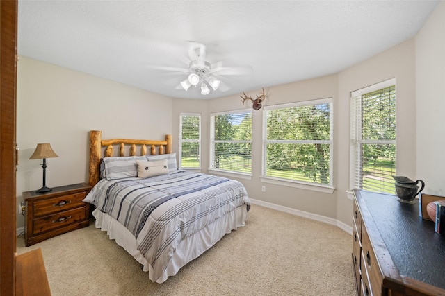 18882 Mystic Pt, Montgomery, TX 77356 - bedroom featuring light colored carpet and ceiling fan