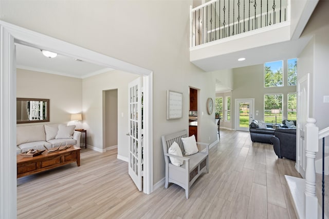 18882 Mystic Pt, Montgomery, TX 77356 - corridor featuring a high ceiling, wood finished floors, crown molding, and french doors