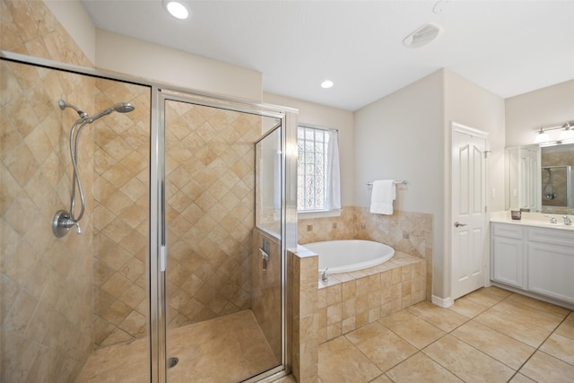 18882 Mystic Pt, Montgomery, TX 77356 - bathroom with vanity, a bath, a stall shower, and recessed lighting
