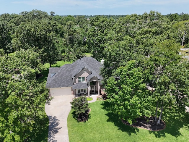 18882 Mystic Pt, Montgomery, TX 77356 - aerial view of property and surrounding area with a heavily wooded area
