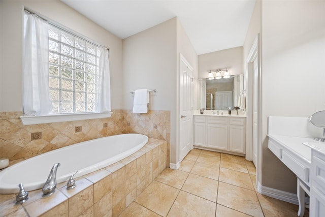 18882 Mystic Pt, Montgomery, TX 77356 - full bathroom featuring vanity, a bath, and tile patterned floors