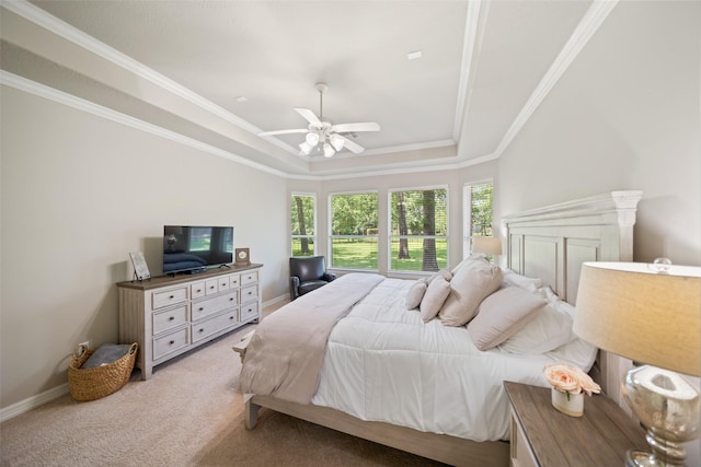 18882 Mystic Pt, Montgomery, TX 77356 - bedroom featuring a tray ceiling, light colored carpet, crown molding, and ceiling fan