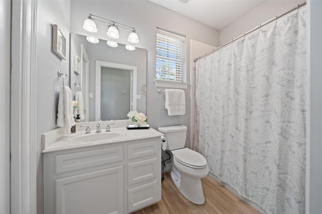18882 Mystic Pt, Montgomery, TX 77356 - full bathroom featuring wood finished floors, vanity, and curtained shower