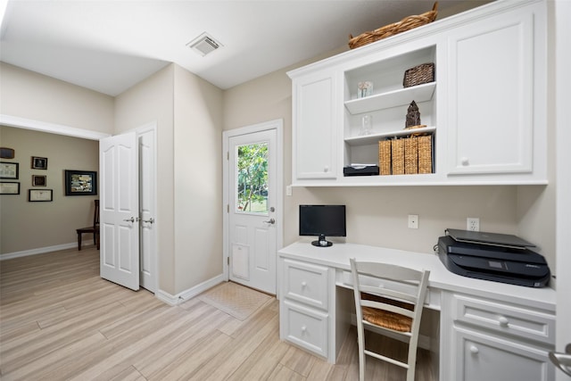 18882 Mystic Pt, Montgomery, TX 77356 - office area featuring built in study area and light wood-style flooring