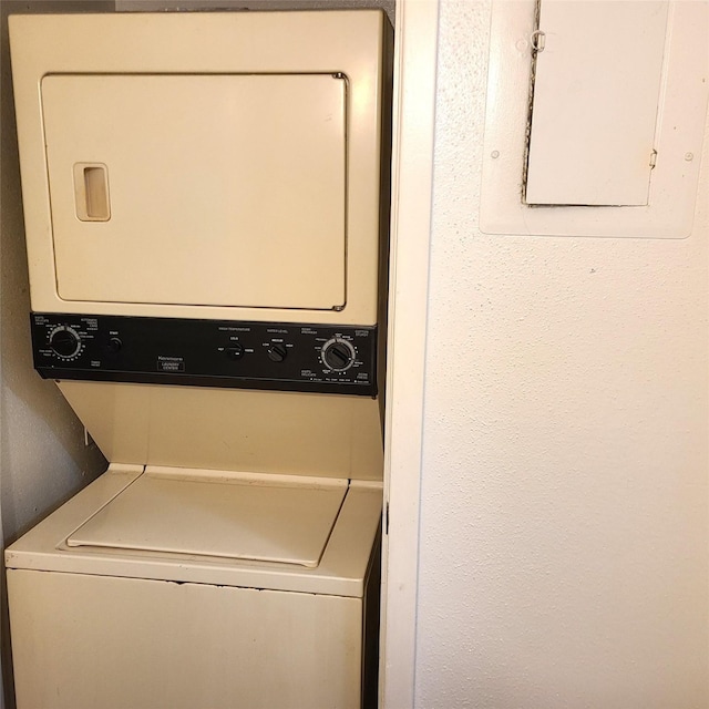 2021 Spenwick Dr Unit 511, Houston, TX 77055 - laundry room featuring stacked washing machine and dryer and electric panel